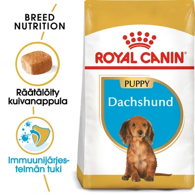 Royal Canin Puppy Dachshund -kuivaruokapakkaus, tekstit: Räätälöity kuivanappula, Immuunijärjestelmän tuki, BREED NUTRITION. Kuvassa myös nappula ja mäyräkoiran pentu.