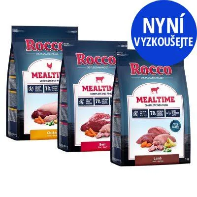 Tři balení Rocco Mealtime Complete Dog Food: Chicken, Beef, Lamb. Na obalech text 70 % animal ingredients. Modrý kruh s nápisem NYNÍ VYZKOUŠEJTE.