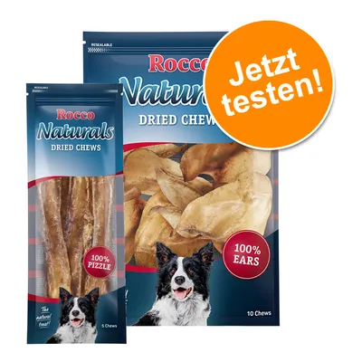 Rocco Naturals Dried Chews, 100% Pizzle und 100% Ears. Verpackung mit Hundebild und orangefarbener Kreis mit Text 'Jetzt testen!'.