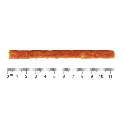 Hnedý žuvací snack v tvare tyčinky, dĺžka približne 11 cm, zobrazený s pravítkom na určenie veľkosti.