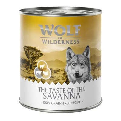 Wolf of Wilderness The Taste of the Savanna, 100% grain-free recipe, can with landscape design and animal icons.