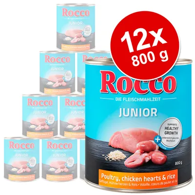 Rocco Junior märkäruoka, 12 x 800 g. Maku: siipikarja, kanan sydämet ja riisi. Etiketissä teksti 'Supports healthy growth'.