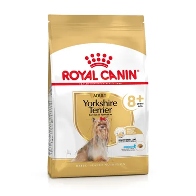 Royal Canin Adult Yorkshire Terrier 8+ hondenvoer, afbeelding van een Yorkshire Terrier, tekst: Healthy Ageing Complex, Healthy Skin & Coat, voor honden ouder dan 8 jaar.