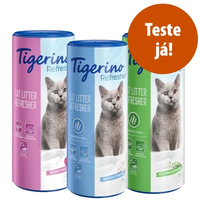 Três embalagens Tigerino Refresher Cat Litter Refresher, aromas Baby Powder, Fresh Cotton e Spring Meadow. Texto visível: 'Teste já!'. Cada embalagem contém 700 g.