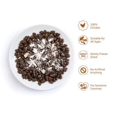 Bowl of kibble with freeze-dried pieces. Key features: 100% chicken, suitable for all ages, gently freeze dried, no artificial ingredients, for sensitive tummies.