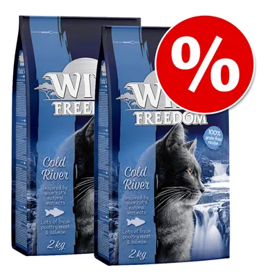 Pachet promoțional Wild Freedom Cold River, 2 pungi a câte 2 kg. Text vizibil: „100% grain-free recipe”, „Lots of fresh poultry meat & salmon”. Simbol procent roșu pentru reducere.
