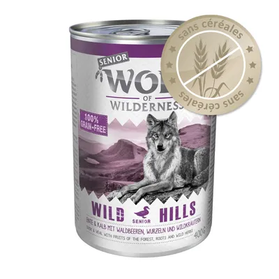 Wolf of Wilderness Senior Wild Hills, 400 g, sans céréales, 100% grain-free, canard & veau avec fruits des bois, racines et herbes sauvages. Badge 'sans céréales' visible.