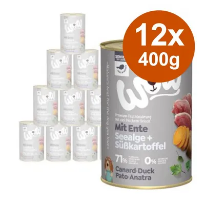 12 lattine da 400 g di cibo umido Wow con anatra, alghe e patata dolce. Testo visibile: Mit Ente, Seealge + Süßkartoffel, 71 %, Canard-Duck Pato-Anatra.