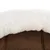 Close-up of brown fabric material with a white, soft plush edge. Detail view of materials for a pet bed.