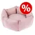 Rund lyserød hundeseng i stof med rød rabatmærke med hvidt procenttegn (%) synligt øverst til højre.