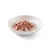 Émincés de viande rose en sauce présentés dans une assiette blanche, sans emballage ni marque visible.