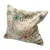 Decorative cushion with floral pattern in pastel colours, including flowers and leaves on beige fabric.