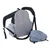 Sac à dos gris avec bretelles rembourrées, poches latérales zippées et une housse de protection posée à côté. Matière textile visible.
