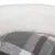 Close-up of a grey and white checked fabric with a soft white plush surface.