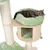 Cat lying in a green plush bed on a multi-level scratching post with sisal-wrapped poles and a lower enclosed area, demonstrating product use.