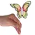 Hand hält einen bunten Schmetterling aus Papier mit weissem Körper an einem dünnen Stab.