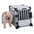 Metal transport box with grid door and plastic elements, next to a dog. Suitable for safe transport of pets.