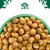 Bowl filled with round, brown dry pet food pieces shown from above.