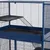 Cage en métal bleu à deux niveaux avec une rampe et un plateau amovible noir, barreaux espacés horizontalement, fond plat visible.