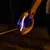 Guinzaglio luminoso per cani con luce LED, manico ergonomico e fettuccia estensibile, adatto per passeggiate al buio.