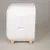 White container with rounded corners and wooden feet, side handle opening visible.
