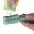 Green dental care chew toy with nubs, filled with toothpaste from tube. Text on tube: Without sugar & grains, food-grade ingredients.