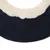 Gros plan sur un coussin ou tapis noir avec bordure en tissu imitation fourrure blanche, sans marque ni texte visible.