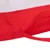 Détail d’un tissu rouge et blanc avec une sangle cousue, matière textile visible. Aucun logo ni texte apparent.