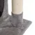 Cat tree with grey plush cover and sisal-wrapped scratching post, close-up of base and post.