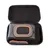 Valise rigide noire ouverte contenant une pochette grise avec fermeture éclair et bordure orange, poche en filet noir visible sur le dessus de la pochette.