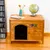Niche en bois avec ouverture en arc, lettres colorées formant le nom SPIKE sur la façade. Objet décoratif, globe et journal posés sur le dessus.