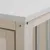 Detailweergave van een houten frame met metalen staven en wit tafelblad, bevestigd met schroeven.