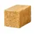 Een gele kubus van geperst materiaal, mogelijk een snack of mineralenblok voor dieren.