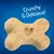 Keksić u obliku kosti s utisnutim srcem, tekst na engleskom: Crunchy & Delicious!