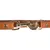 Close-up of a brown leather dog lead with gold-coloured metal snap hook and studs.