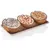 Three half coconut shells with fillings: sunflower seeds, peanuts and mealworms on a tray. Suitable as bird food.