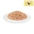 Close-up of shredded wet food on a white plate. Yellow symbol with black chicken in the top right.