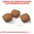 Tres croquetas de pienso con texto: Formulado específicamente con nutrientes activos. Escala visible de 1 cm para referencia de tamaño.