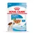 Royal Canin Puppy Mini 85 g, pour chiots 2–10 mois, poids adulte jusqu’à 10 kg, bouchées en sauce, sans conservateurs, photo d’un petit chien et de la nourriture visible sur l’emballage.