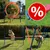 Conjunto de obstáculos de agility para perros en uso, incluye aro, vallas y postes de slalom. Símbolo de porcentaje rojo indica oferta o descuento visible en la imagen.
