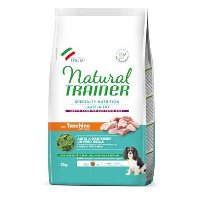 Zak Natural Trainer Specialty Nutrition Light in Fat hondenvoer, met kalkoen. Tekst: Aiuta a mantenere un peso ideale, 2 kg. Afbeelding van hond en kalkoenstukjes op de verpakking.