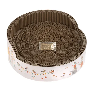 Griffoir rond en carton ondulé avec sachet transparent au centre, bord décoré de dessins d’animaux festifs et guirlandes colorées visibles sur le pourtour extérieur.