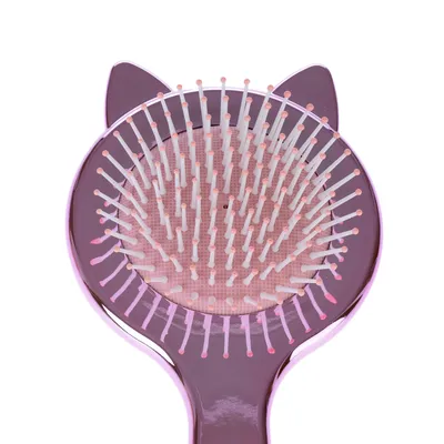 Rosa Bürste mit weichen Kunststoffborsten und katzenförmigem Design, geeignet für Fellpflege.