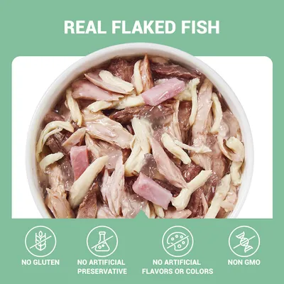 Mokra hrana s komadićima ribe u zdjelici. Tekst: REAL FLAKED FISH, NO GLUTEN, NO ARTIFICIAL PRESERVATIVE, NO ARTIFICIAL FLAVORS OR COLORS, NON GMO (tekst na engleskom jeziku).
