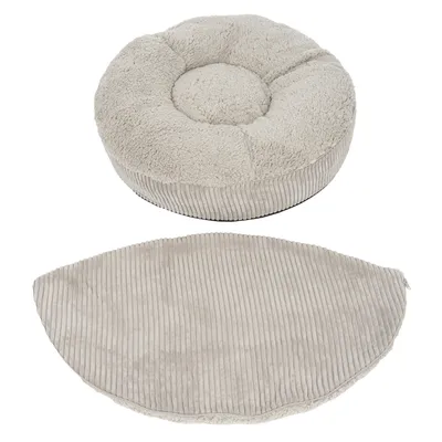 Rond, beige kussen met een afneembare hoes van corduroy en pluche, beide delen naast elkaar getoond.