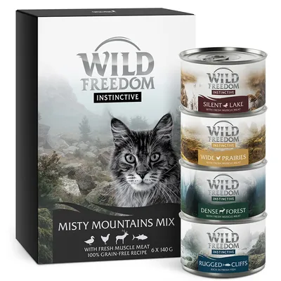 Wild Freedom Instinctive Misty Mountains Mix, 6 x 140 g. Boîtes visibles : Silent Lake, Wide Prairies, Dense Forest, Rugged Cliffs. Recette sans céréales, viande fraîche.