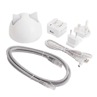 Set includes a dome-shaped device with two ear-like points, power adapters for UK and EU plugs, USB cable, Ethernet cable, and power supply unit.
