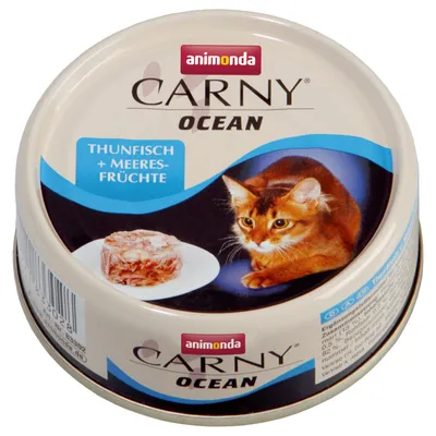 Консерва Animonda Carny Ocean за котки, надпис THUNFISCH + MEERESFRÜCHTE, изображение на котка и порция храна върху чиния. Метална опаковка.