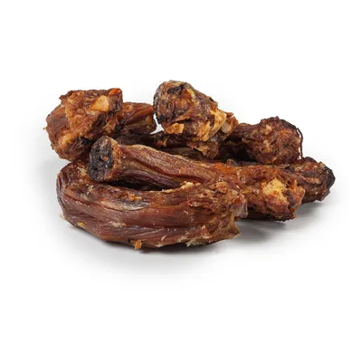 Dried meat pieces, brown and crispy, likely as a snack or chew for pets.