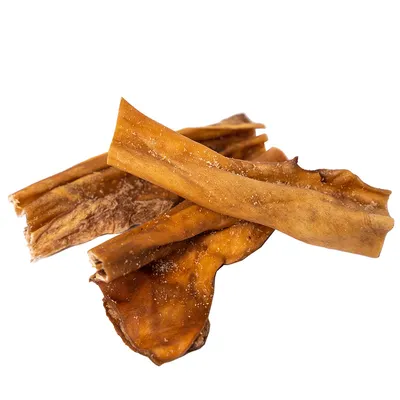 Flere brune, tørrede tyggepinde af naturligt materiale, egnet som hundesnack.